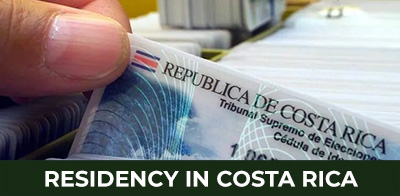 Expat couple consulting with legal advisors about Costa Rica residency requirements — Guidance on relocation and residency options.