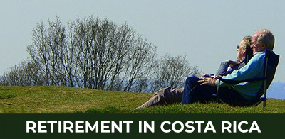 Happy retired couple exploring property options in Costa Rica — Homes, condos, farms, and vacation rentals for retirement living.